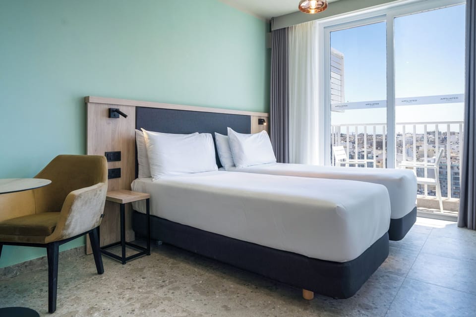 Standard Twin Room | Down comforters, minibar, in-room safe, desk