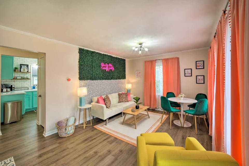 Upstairs living/dining combo with futon, smart TV and photo op w/ light-up neon!