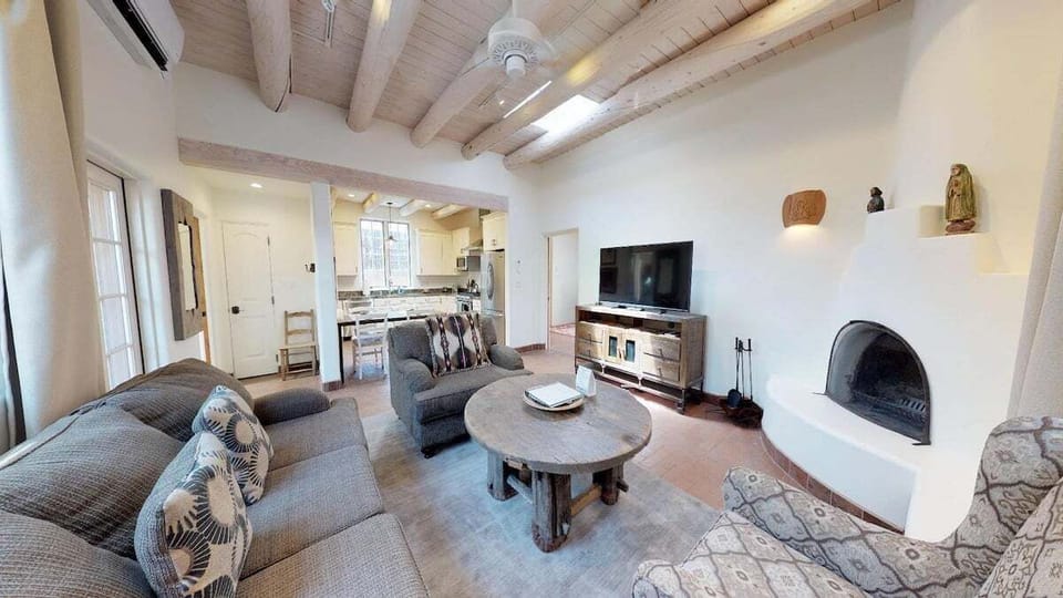 Living room with kiva fireplace and smart TV