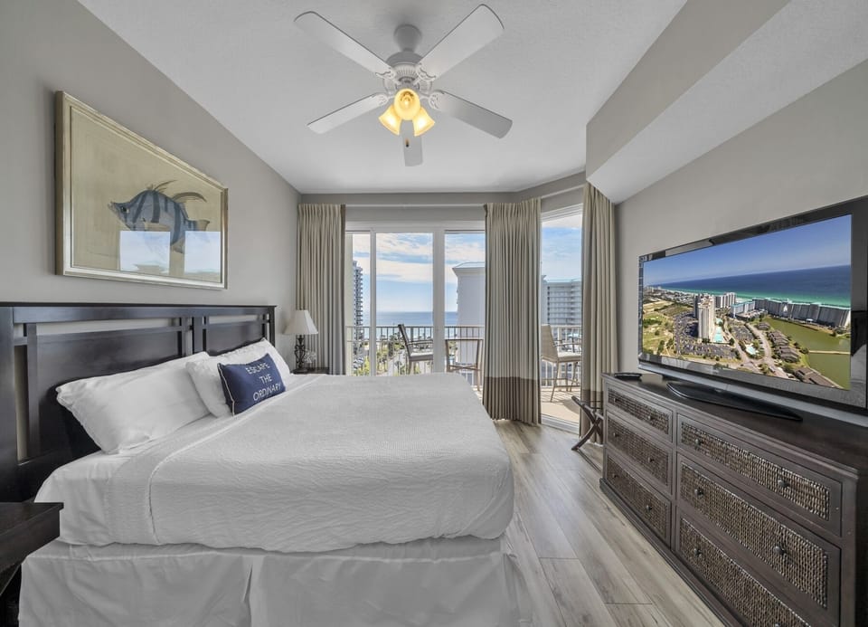 Suggestion 2: Relaxing primary suite featuring a king bed, 53" TV, and Gulf-view balcony.