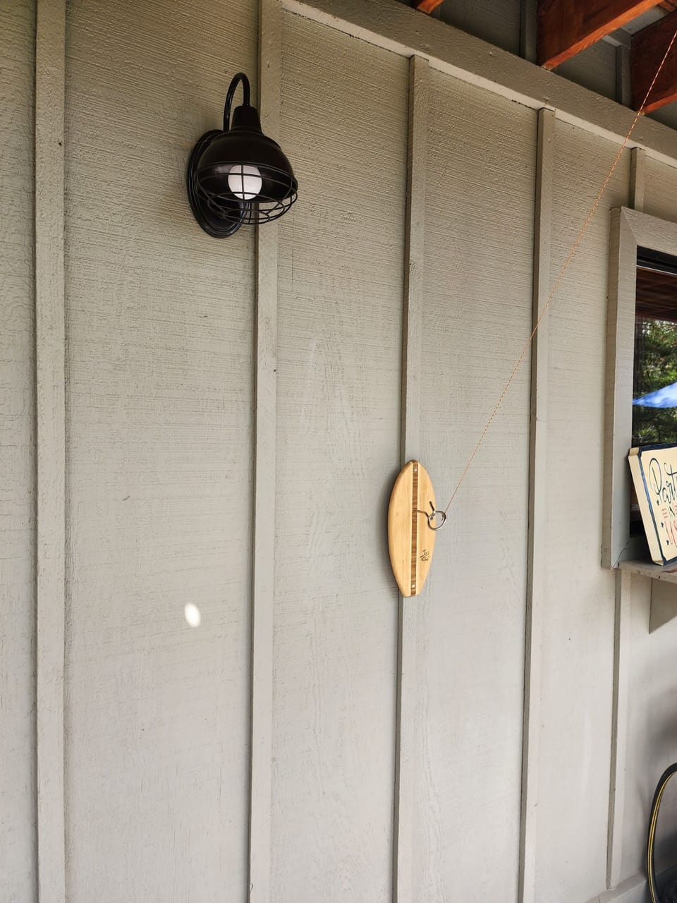 Darts, corn hole boards, ring toss game on large wrap around deck