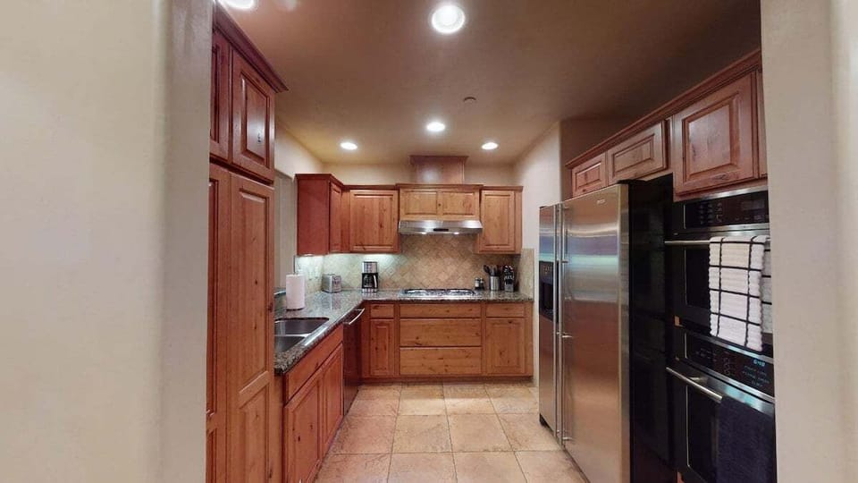 Large kitchen with granite countertops
