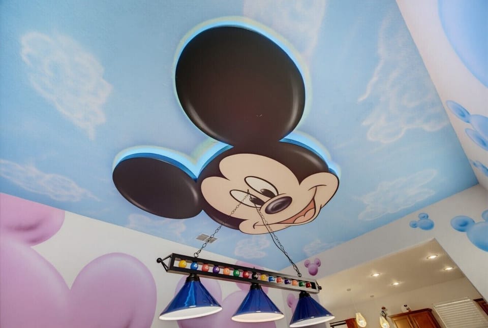 Ceiling artwork above the billiards table