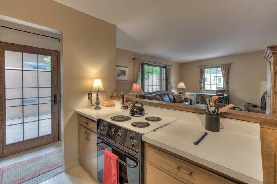Kitchen bar and view of living room