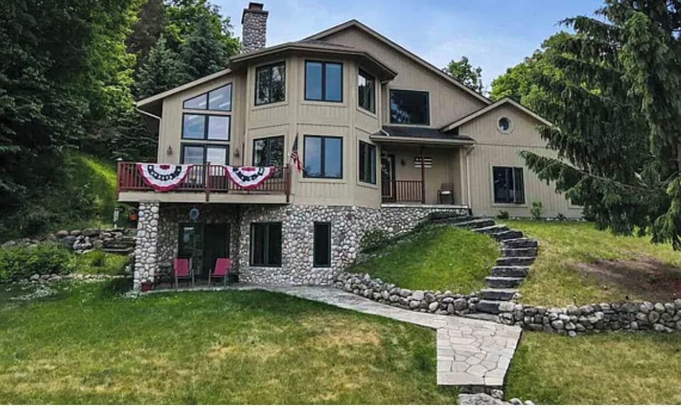 4 bedroom/3 & 1/2 bath walkout with 50 feet on lake Charlevoix 