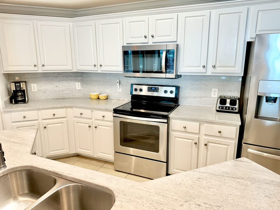 Kitchen features stainless steel appliances if you want to stay in and cook.