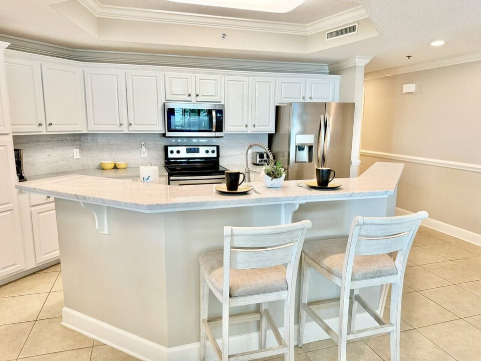 Quartz bar top counter space provides extra seating and eating room.