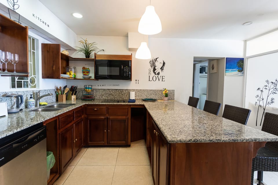Fully equipped kitchen with a mini dining area 