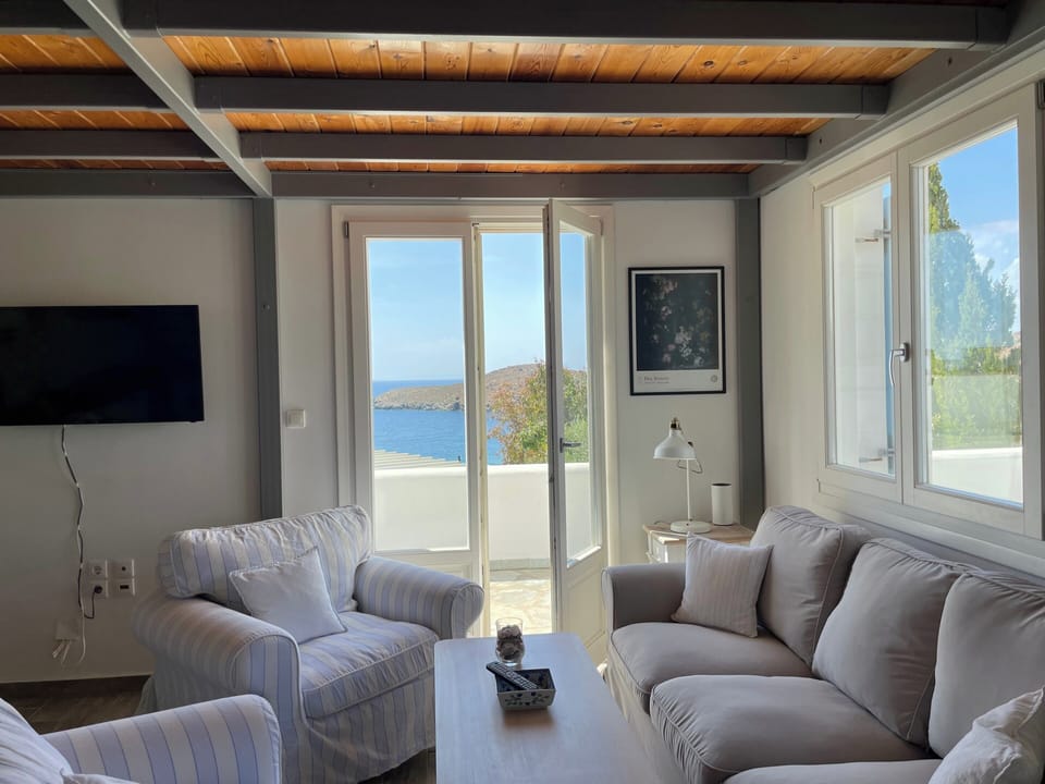 The living room overlooks the beach and sea directly. The living room has a TV with Netflix.