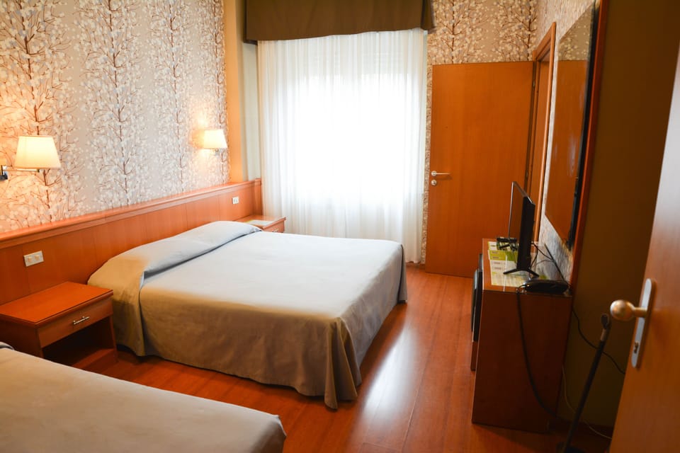 Triple Room | Down comforters, minibar, in-room safe, desk