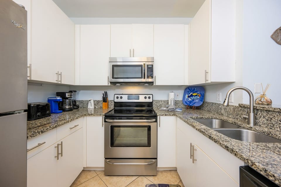 Condo, 2 Bedrooms | Private kitchen | Coffee/tea maker, fridge, oven