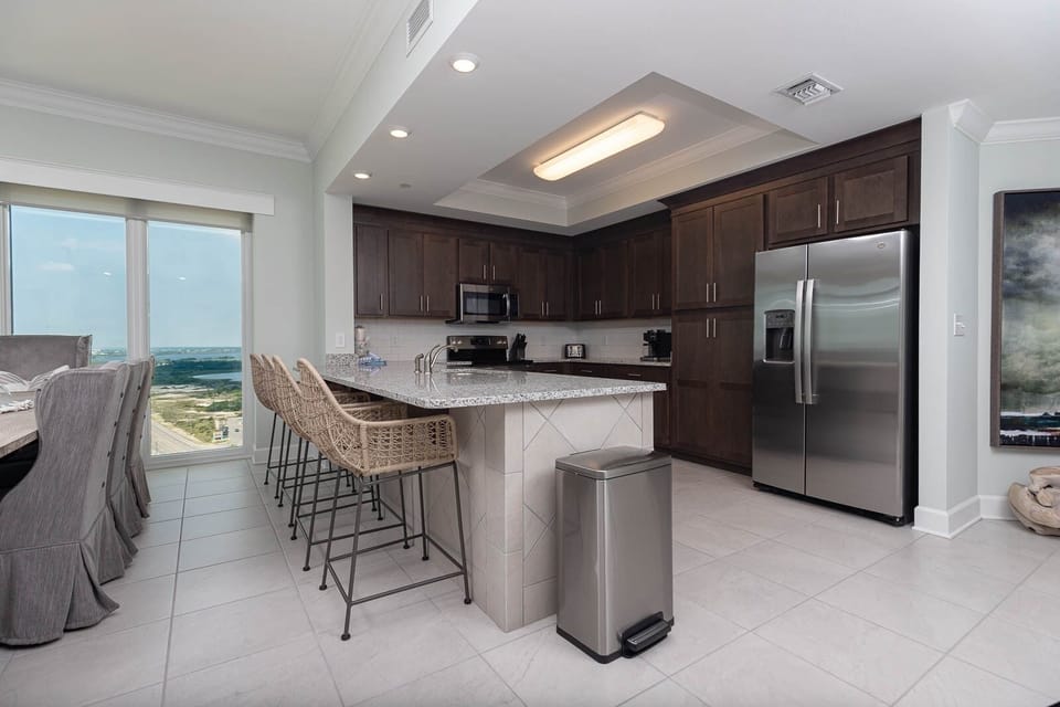 Condo, 4 Bedrooms | Private kitchen | Fridge, oven, coffee/tea maker