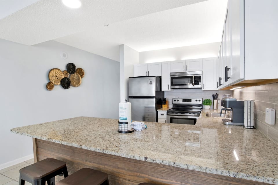 Plenty of room to put your things, eat, cook, catch up over morning coffee (check out the "My Happy Place" mugs!).