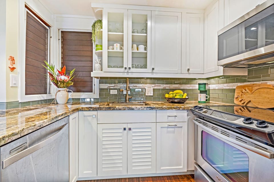 Ktichen - Kitchen with full-size stainless steel appliances. Microwave, stove, oven, and dishwasher