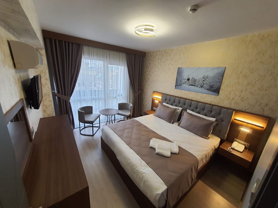 Standard Double Room | Free minibar items, in-room safe, laptop workspace, iron/ironing board