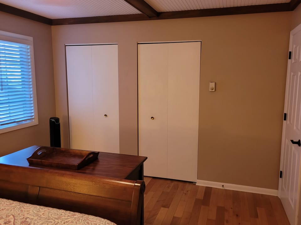 BEDROOM #1 (SECOND FLOOR):  Features a queen-size bed, nightstands, lamps, dresser, mirror, 2 closets, and its own private entrance to the bathroom on the second floor.