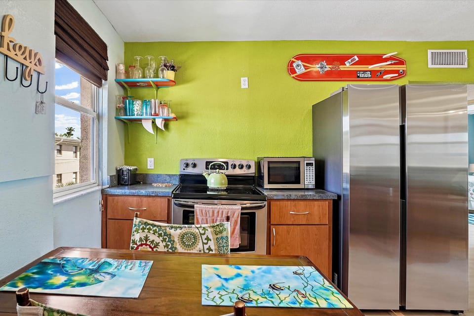 Full kitchen with Surfboards on the Walls!  COOL :)