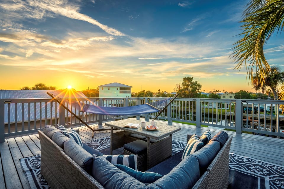 Private upper deck-sunset views, lounge seating, & coastal breezes.
