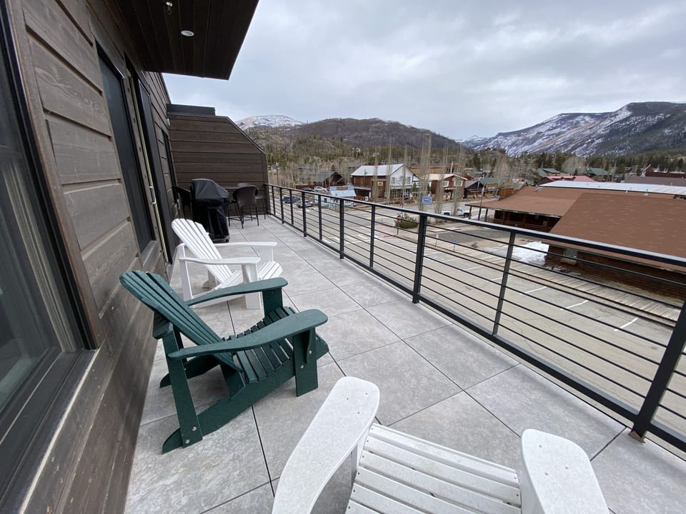 Enjoy the view from the large deck.  View of the lake, downtown and RMNP.