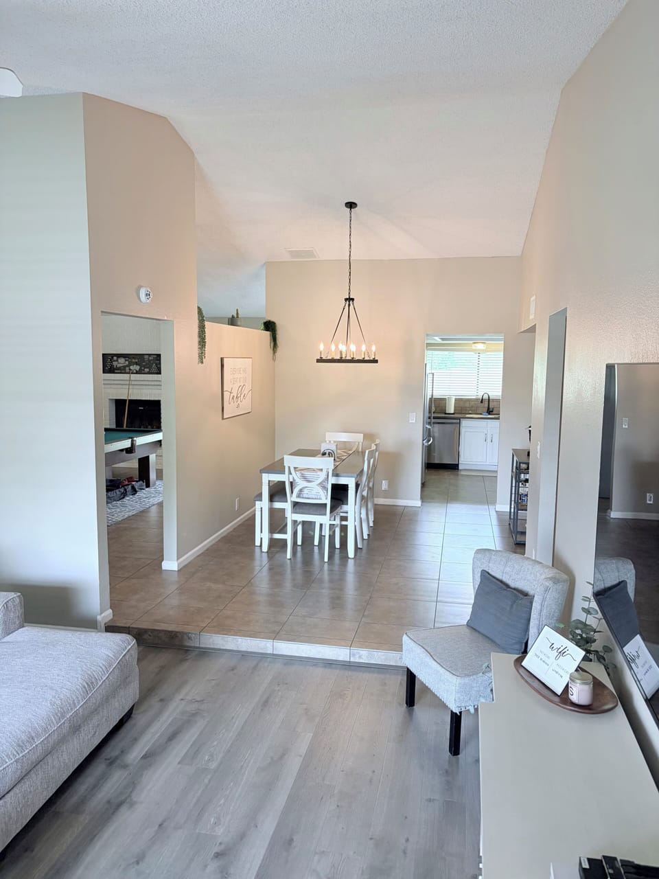 Open Concept living room to Dining room, with connection to Pool Room & Kitchen