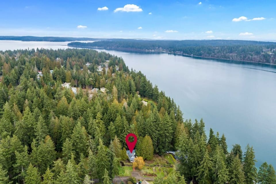 The property is on the water and has a private beach access.