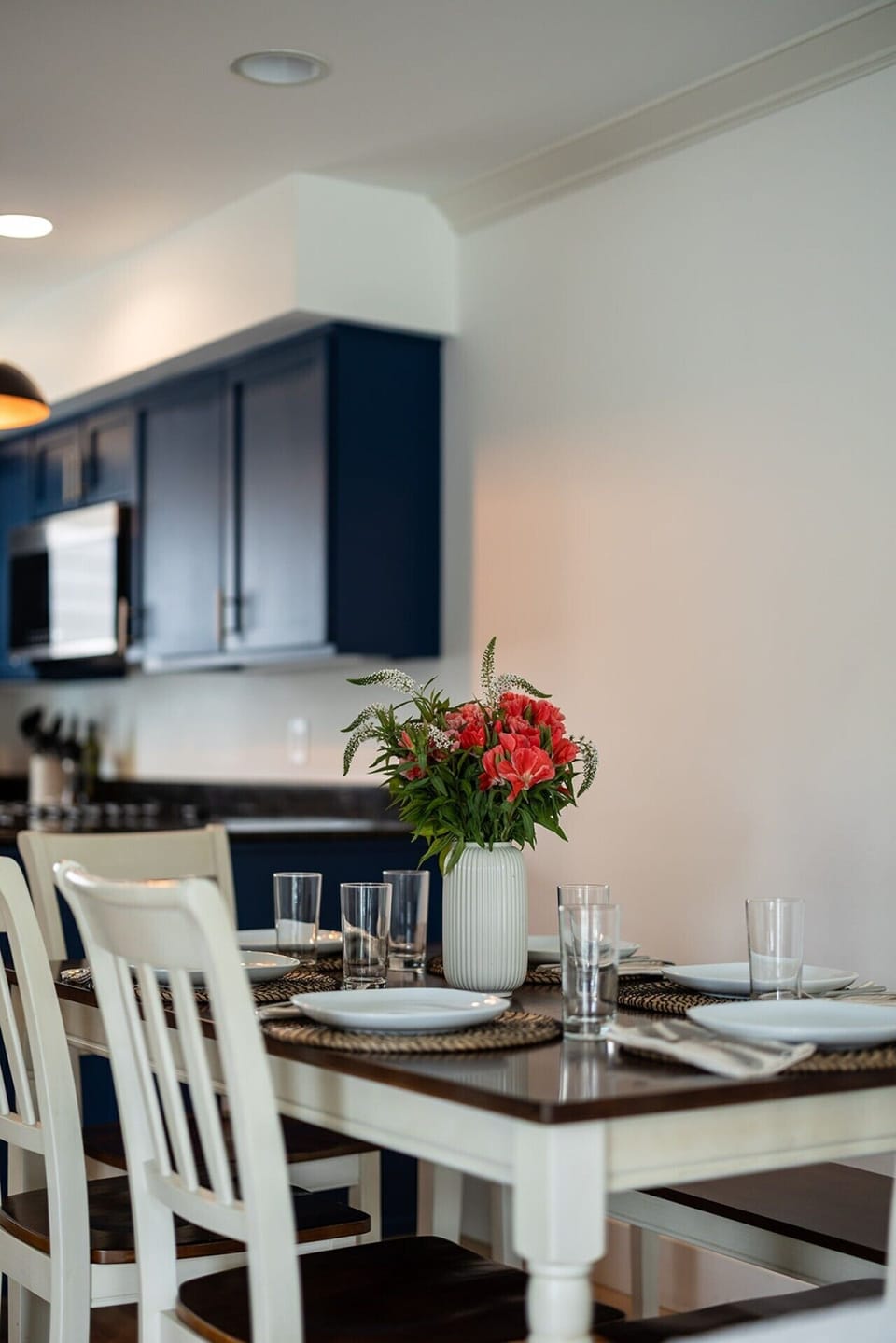 Bright dining area with navy cabinetry, perfect for shared meals