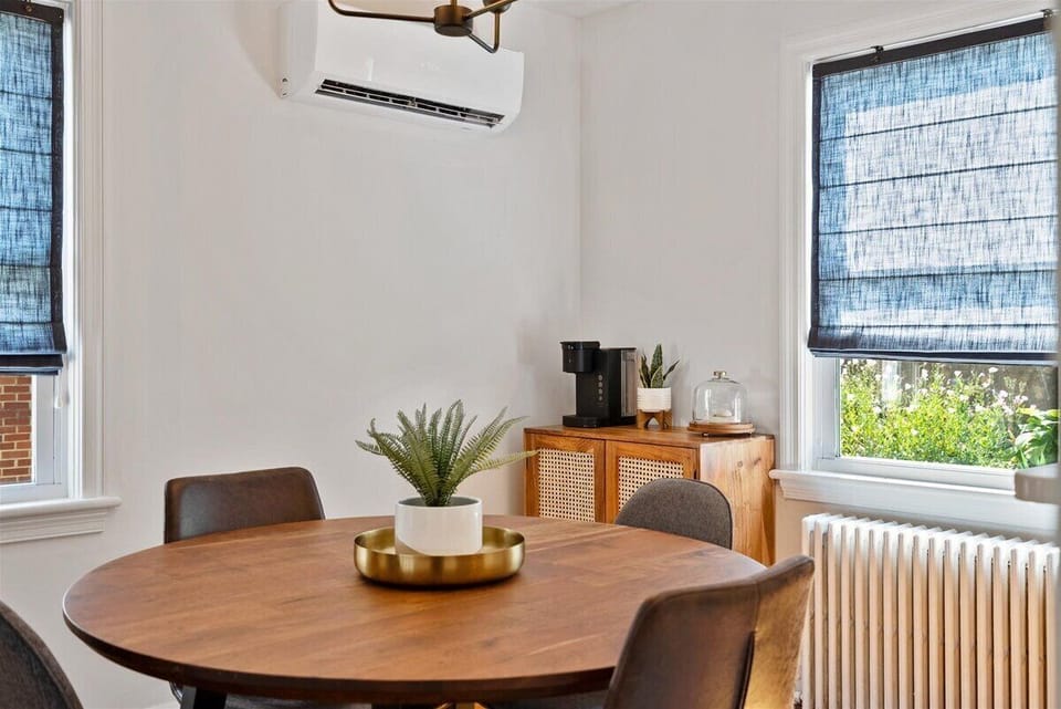 Dining table for seating in the dining room, w/ a coffee bar, and great lighting