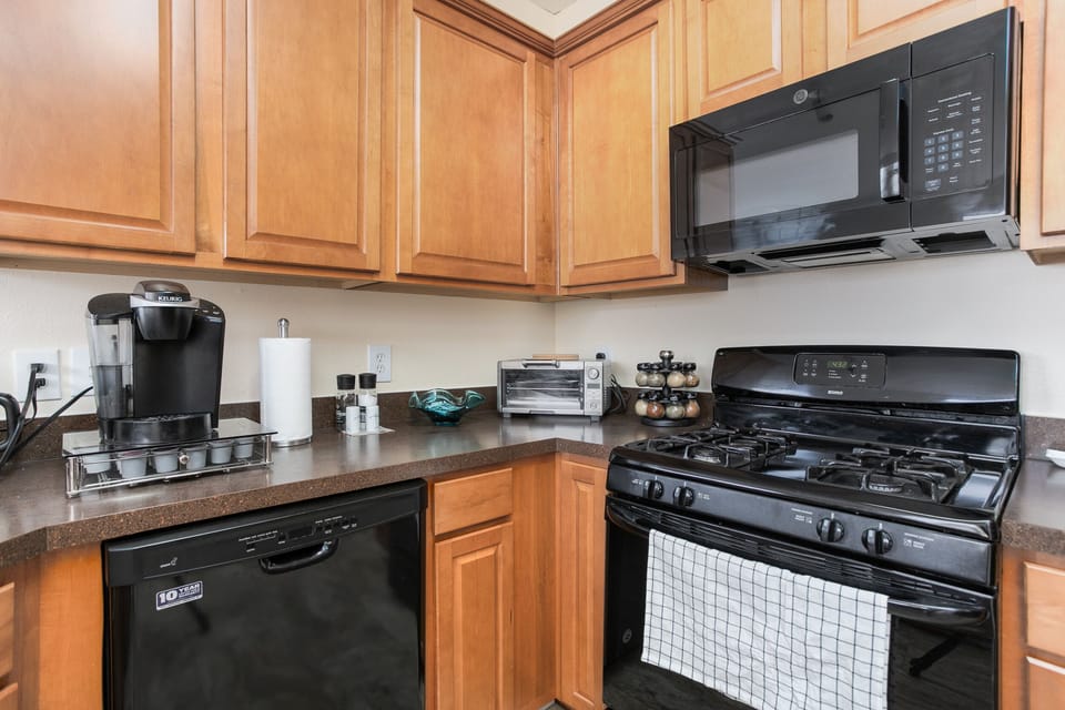 Kitchen has all the pots and pans for cooking 