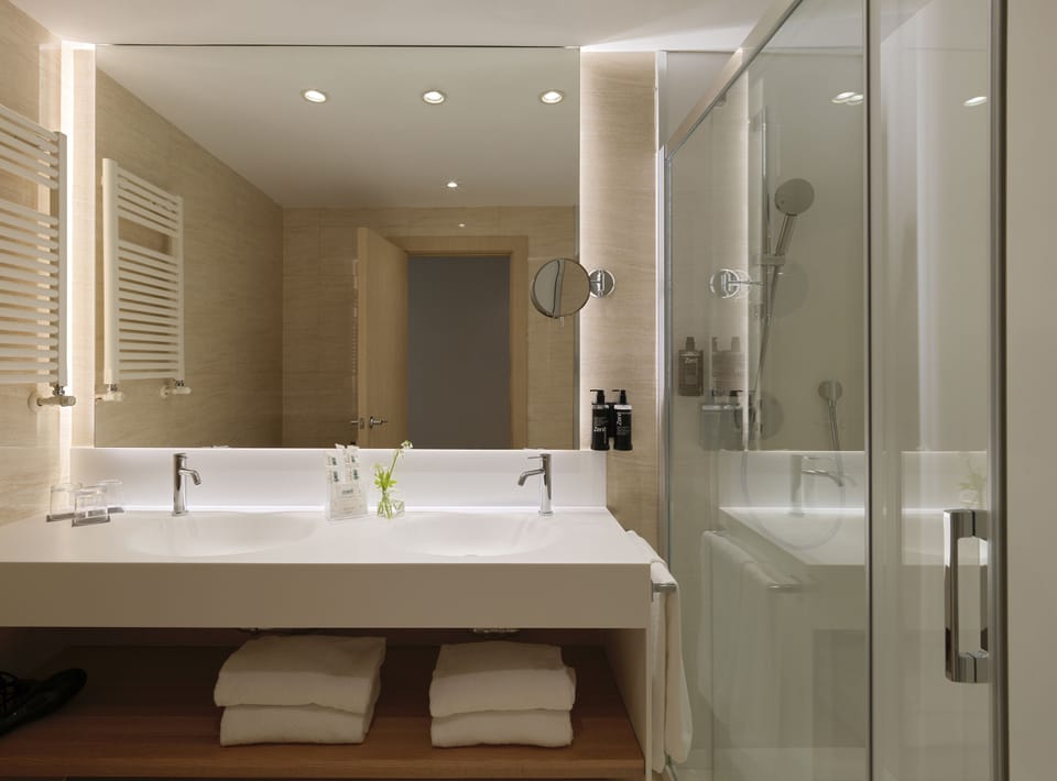 Eco-friendly toiletries, hair dryer, bidet, towels