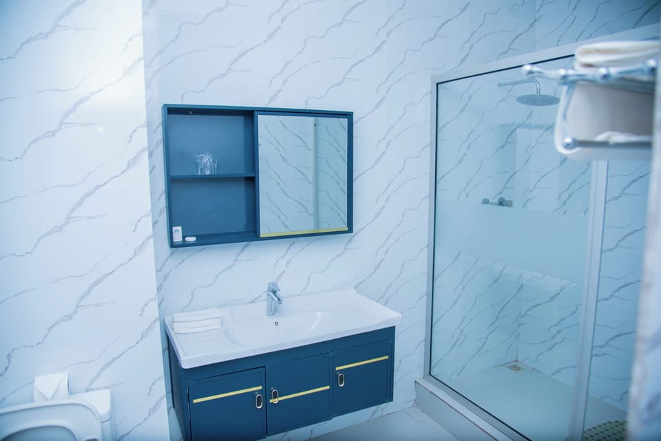 Standard Double Room | Bathroom | Deep soaking tub, free toiletries, hair dryer, bathrobes
