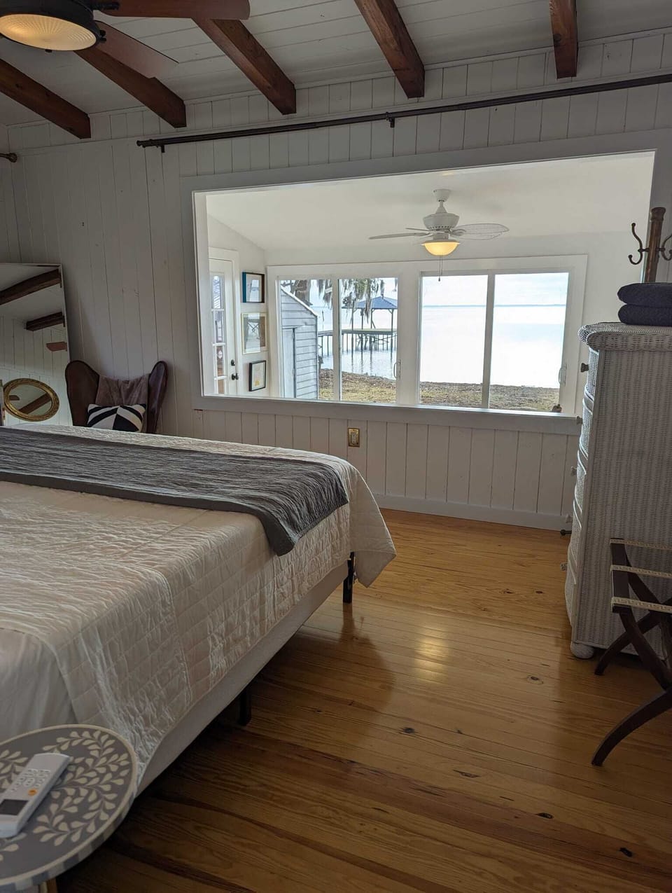 The master bedroom has a cut out in the wall for lake views from bed