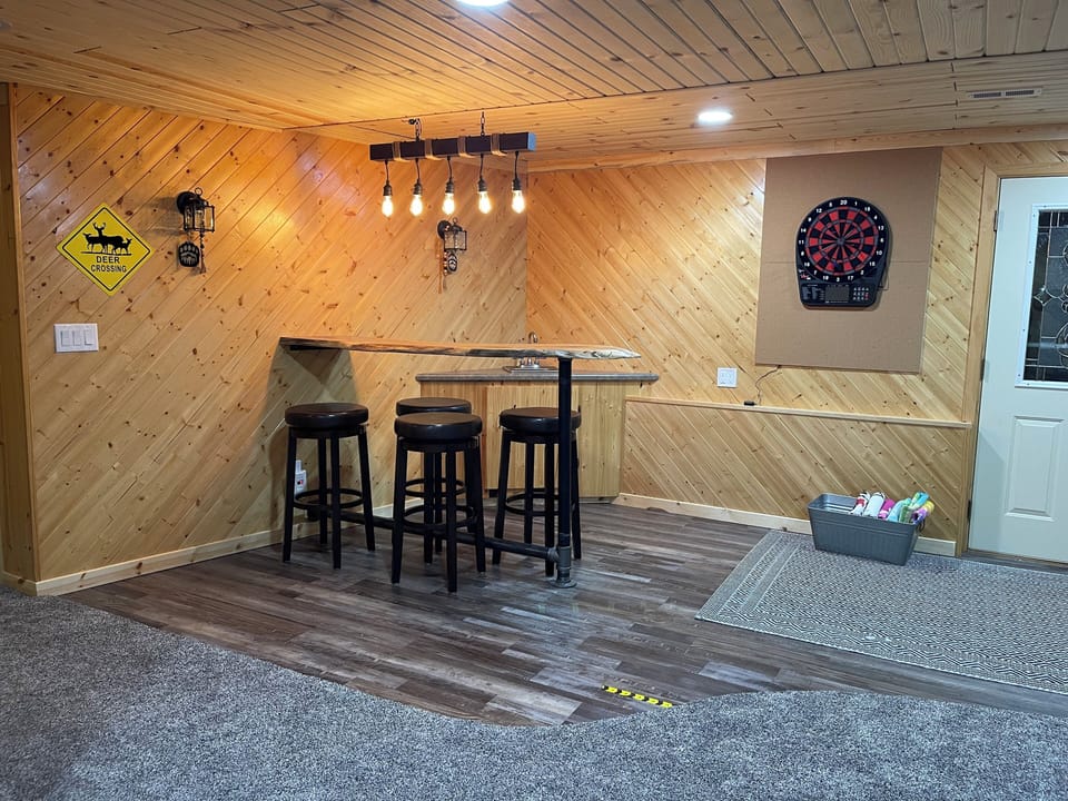 Walk out level Family Room Game area with Dartboard and Board Games