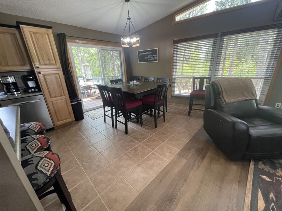 Dining room seating for 8 at table and 3 at kitchen island