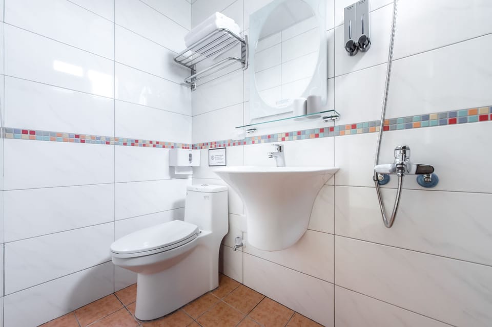 Deluxe Double Room, Balcony | Bathroom | Shower, hair dryer, slippers, towels