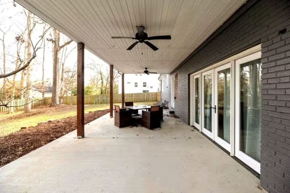 Back porch Patio with Patio furniture and string lights!