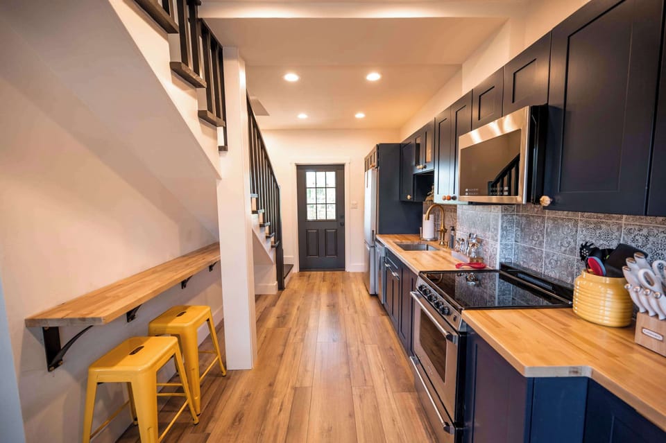 Kitchen with refrigerator,  dishwasher, stove and microwave