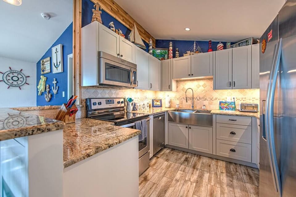 The kitchen is fully stocked with pots, pans, and cooking equipment for the chefs in the family. 