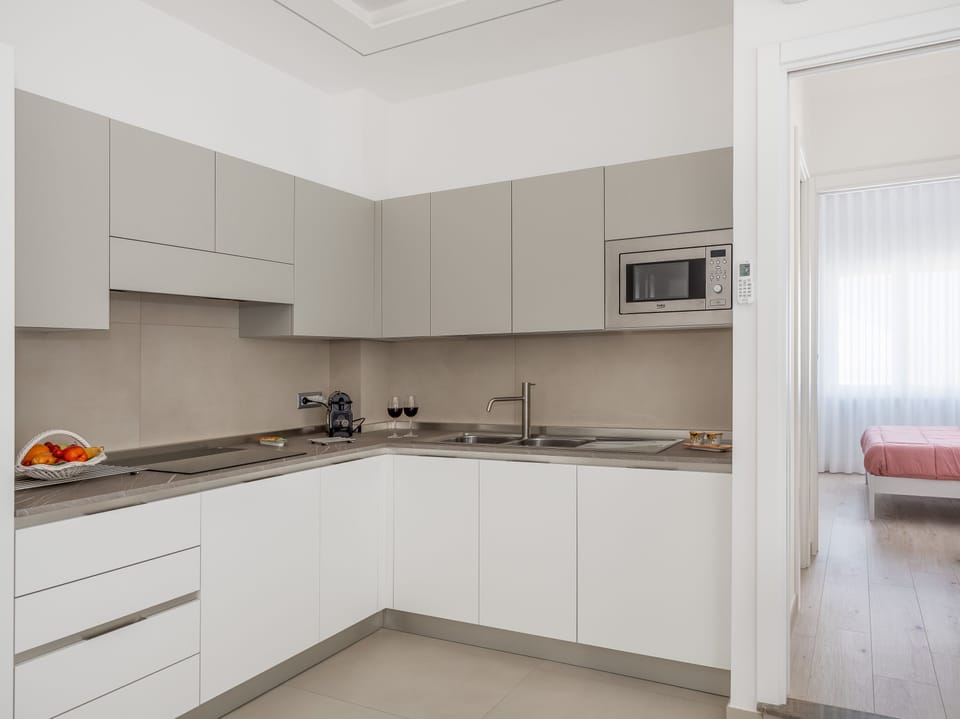 Comfort Apartment | Private kitchen | Full-size fridge, microwave, oven, stovetop
