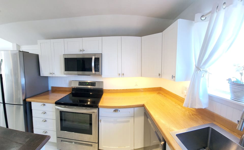 Kitchen off of LR. All new appliances with induction cooktop.