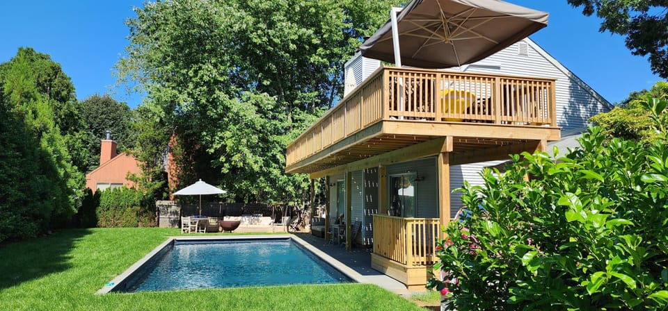 Fully fenced back yard and overlooking deck.