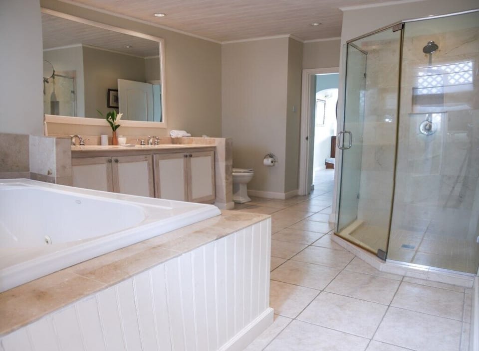Master bathroom also has a soaking tub.
