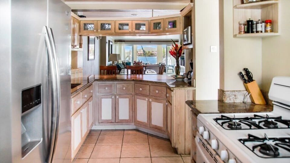 Kitchen looking over the dining & living space out to the water.