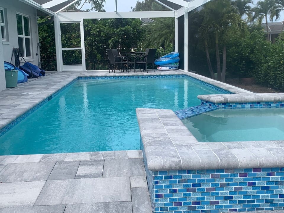 TALL CLUSIA BUSHES ADD PRIVACY TO THE WHOLE POOL DECK 