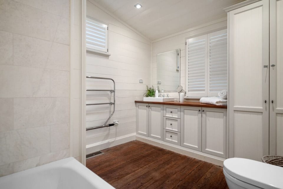 Full sized bathroom with soaking tub and rain shower. Luxurious ikou products are provided for your use.