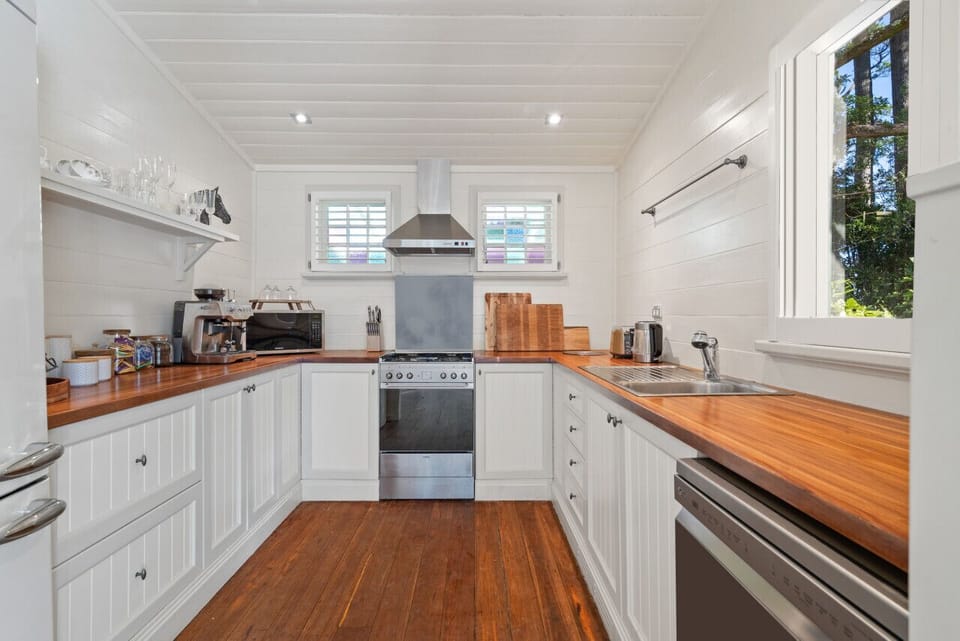 The Coach House has full kitchen with coffee machine, electric oven, gas cooktop, and dishwasher.