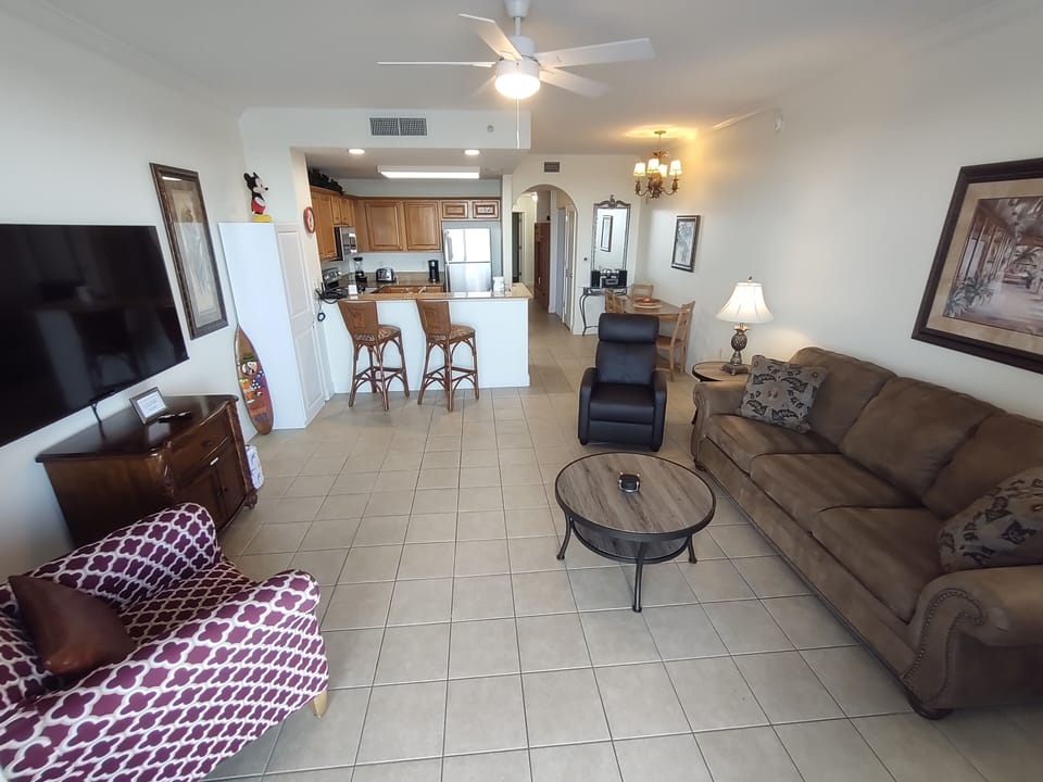 Large Living Room area with queen pull out sofa bed and 65 inch smart led TV