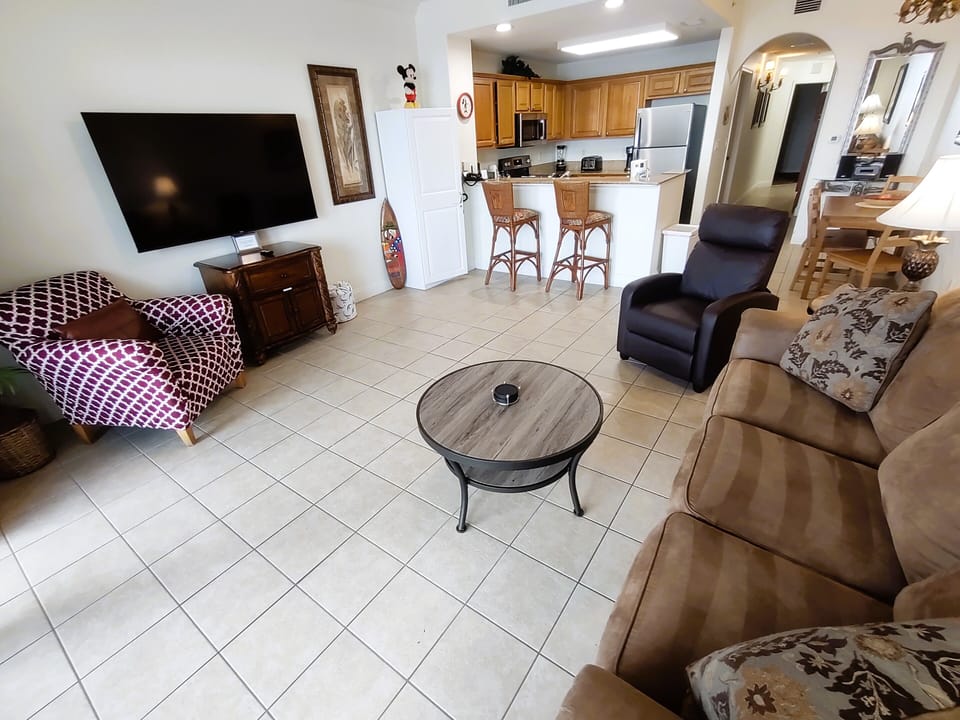 Large Living Room area with queen pull out sofa bed and 65 inch smart led TV