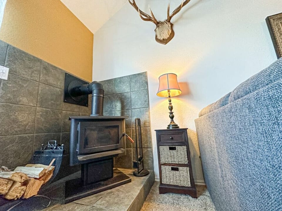 Experience the cozy ambiance of our wood-burning fireplace, perfect for warming up after a day of outdoor adventures.