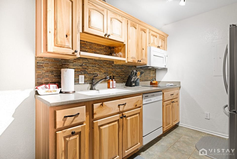The kitchen is stocked with cooking basics and includes a coffee maker