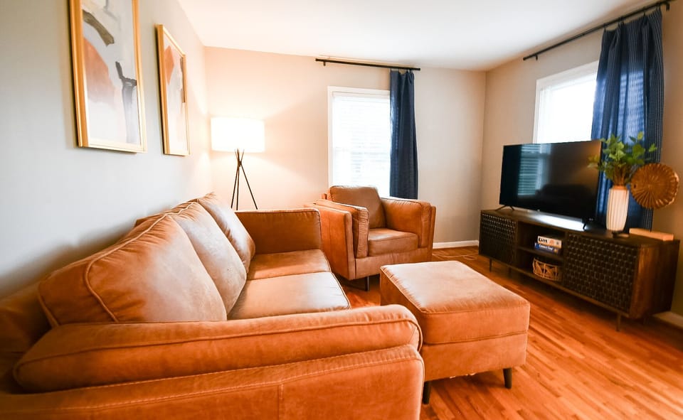 New Leather Couch with 55 inch streaming tv + Chair / Ottoman